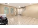 Bright and spacious entryway with tiled floors and staircase at 1940 N 78Th Gln, Phoenix, AZ 85035