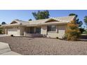 Single-story home with a two-car garage and drought-tolerant landscaping at 2544 S Daisy --, Mesa, AZ 85209