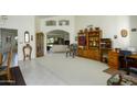 Bright living room with vaulted ceilings, comfy seating, and views to the golf course at 2544 S Daisy --, Mesa, AZ 85209