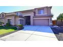 Two-story house with a landscaped lawn and attached garage at 3267 E Maplewood St, Gilbert, AZ 85297