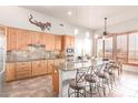 Modern kitchen with light wood cabinets and granite countertops at 36445 N 14Th St, Phoenix, AZ 85086