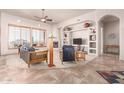 Spacious living room featuring a fireplace and built-in shelving at 36445 N 14Th St, Phoenix, AZ 85086