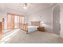 Bright main bedroom with plantation shutters and patio access at 36445 N 14Th St, Phoenix, AZ 85086