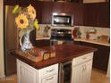 Well-equipped kitchen with stainless steel appliances and a center island at 440 S Val Vista Dr # 52, Mesa, AZ 85204