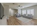 Spacious living room with hardwood floors and comfortable sofas at 4627 S Grenoble Cir, Mesa, AZ 85212