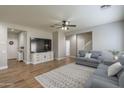 Light-filled living room featuring hardwood floors and ample seating at 4627 S Grenoble Cir, Mesa, AZ 85212