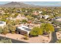 Home with solar panels and a large backyard, mountain views in the distance at 4706 E Rancho Caliente Dr, Cave Creek, AZ 85331