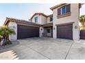 Two-story house with a two-car garage and front yard at 581 W Reeves Ave, San Tan Valley, AZ 85140