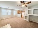 Open living space with kitchen views and built-in shelving at 6710 E University Dr # 147, Mesa, AZ 85205