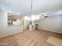 Spacious living area with kitchen and staircase views at 6710 E University Dr # 147, Mesa, AZ 85205