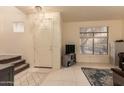 Bright entryway with tile floors and staircase at 7304 E Northridge Cir, Mesa, AZ 85207