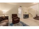 Living room with recliner and view into kitchen at 7304 E Northridge Cir, Mesa, AZ 85207