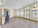 Spacious dining area with tile floors and access to the kitchen at 8494 E Gilded Perch Dr, Scottsdale, AZ 85255