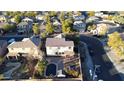 Aerial view showcasing a two-story house with a pool and backyard at 8709 W Hammond Ln, Tolleson, AZ 85353