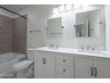 Clean bathroom with double sinks and a spacious vanity at 9321 W Hillcrest Pl, Arizona City, AZ 85123