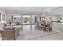 Open floor plan with dining area, large windows, and tiled floor at 11175 N 121St Way, Scottsdale, AZ 85259