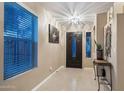 Welcoming entryway with stylish dark wood front door and tile floors at 1194 E Lakeview Dr, San Tan Valley, AZ 85143