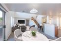 Open concept dining area with marble table and view of living room at 1552 E Oak Rd, San Tan Valley, AZ 85140
