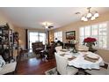 Bright dining area with hardwood floors and white table setting at 1780 W Morse Dr, Anthem, AZ 85086