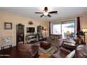 Spacious living room with hardwood floors and comfortable furniture at 1780 W Morse Dr, Anthem, AZ 85086