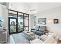 Spacious living room with floor to ceiling windows and city views at 310 S 4Th St # 1504, Phoenix, AZ 85004