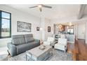Living room with hardwood floors, comfortable seating and city views at 310 S 4Th St # 1504, Phoenix, AZ 85004