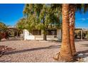 Single story home with carport and landscaped yard at 430 S 81St Pl, Mesa, AZ 85208