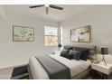 Serene bedroom with a large window and a comfortable queen-sized bed with gray accents at 19777 N 76Th St # 3246, Scottsdale, AZ 85255