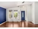 Entryway with hardwood floors and a blue accent wall at 3301 S Goldfield Rd # 2068, Apache Junction, AZ 85119