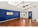 Bright living room with hardwood floors and a view of the front entrance at 3301 S Goldfield Rd # 2068, Apache Junction, AZ 85119