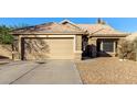 House exterior featuring a beige stucco facade and tile roof at 474 E Jasper Dr, Gilbert, AZ 85296