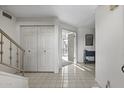 Bright entryway with tile floors, staircase, and coat closet at 6249 N 78Th St # 58, Scottsdale, AZ 85250