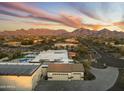 Home features solar panels, a pool, and a large backyard with mountain views at 8802 E Rimrock Dr, Scottsdale, AZ 85255