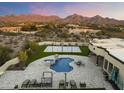 Resort-style backyard oasis with a pool, spa, and outdoor sports court at 8802 E Rimrock Dr, Scottsdale, AZ 85255