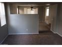 Spacious living room with carpet and partial kitchen view at 14737 N 174Th Dr, Surprise, AZ 85388