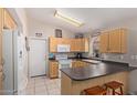 Efficient kitchen with ample cabinetry and modern appliances at 15306 W Eureka Trl, Surprise, AZ 85374