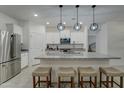 Modern kitchen with granite countertops and stainless steel appliances at 19945 W Badgett Ln, Litchfield Park, AZ 85340