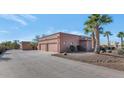 Three-car garage with a large driveway offering ample parking space at 2625 W Desert Hills Dr, Phoenix, AZ 85086