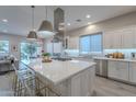 Spacious kitchen with large island, modern stainless steel appliances, and bright, natural light at 290 E Tangerine Path, Queen Creek, AZ 85140