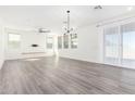 Spacious living room with hardwood floors and ceiling fan at 3600 W Cobalt Ct, San Tan Valley, AZ 85144