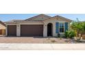 Two-car garage and landscaped front yard at 40365 W Haley Dr, Maricopa, AZ 85138