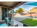 Covered patio with seating area overlooking the pool at 6943 N 88Th Dr, Glendale, AZ 85305