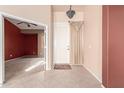 Bright entryway with tile flooring and views to an adjacent room at 7928 E Obispo Ave, Mesa, AZ 85212