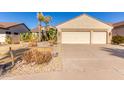 Two-story house with a three-car garage and desert landscaping at 7928 E Obispo Ave, Mesa, AZ 85212