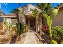Inviting front entrance with desert landscaping and walkway at 7928 E Obispo Ave, Mesa, AZ 85212