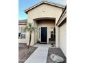 The front of a house with a custom security door and a bench at 861 E Toledo St, Gilbert, AZ 85295