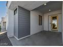 Side entry with gray siding and a yellow door at 1113 E La Mirada Dr, Phoenix, AZ 85042