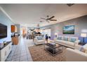 Spacious living room with tile floors and a view of the kitchen at 21925 N 78Th Dr, Peoria, AZ 85383