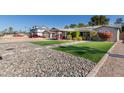 House exterior with a carport, landscaping, and stone accents at 3323 N 28Th St, Phoenix, AZ 85016