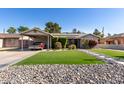 House exterior showcasing a carport and well-maintained lawn at 3323 N 28Th St, Phoenix, AZ 85016